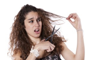 Woman cutting her hair